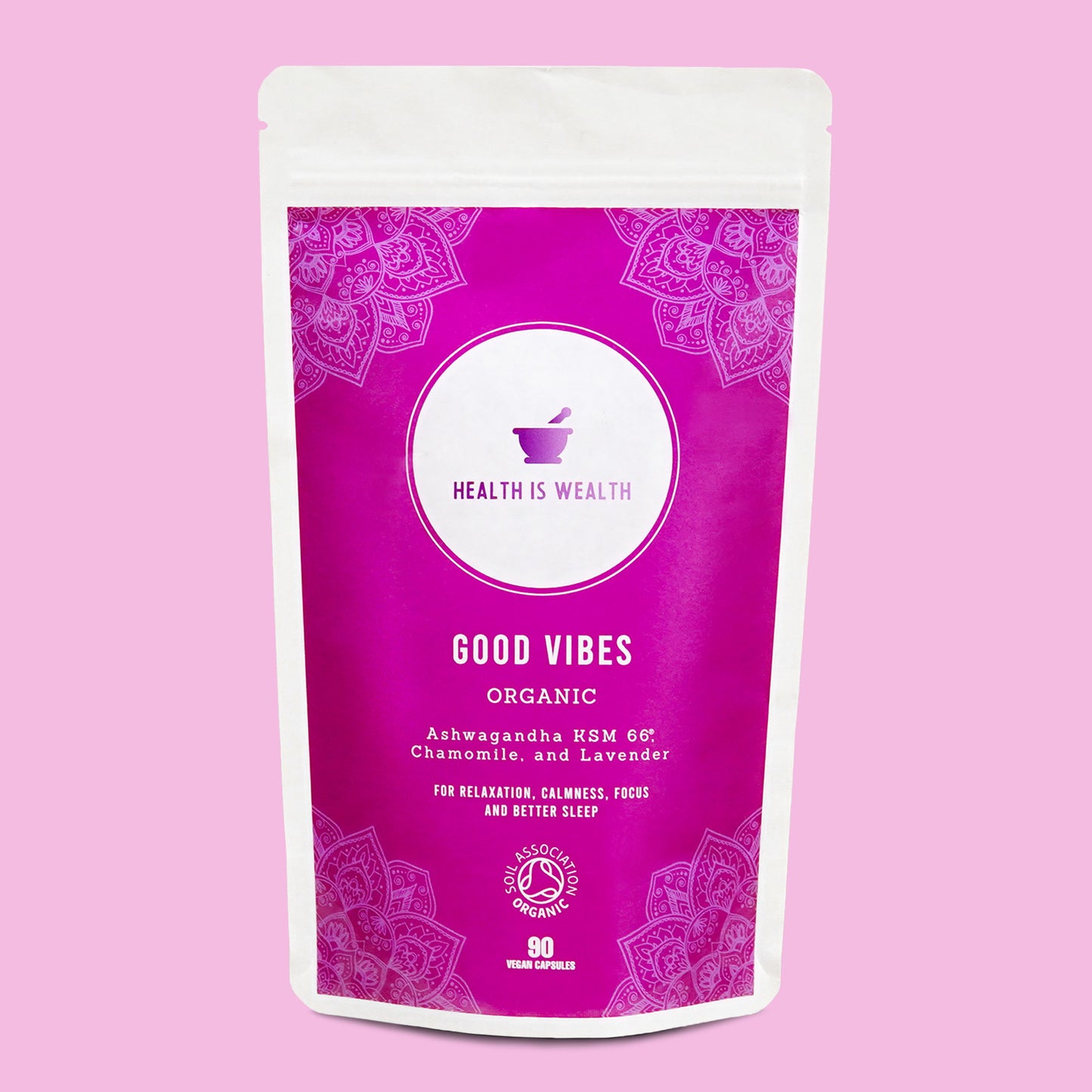 The image showcases the "GOOD VIBES" supplement by Health is Wealth, an organic and natural stress relief supplement. The vibrant purple packaging features intricate mandala patterns and states its contents of Ashwagandha KSM 66, Chamomile, and Lavender, which are advertised to promote relaxation, focus, and better sleep. The pouch indicates a quantity of 90 vegan capsules.